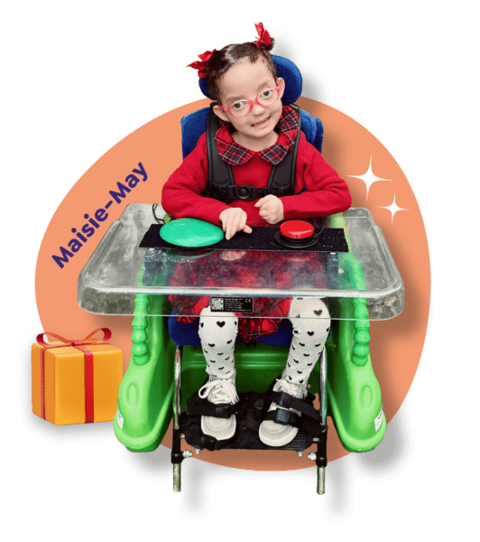 Little girl in a powered wheelchair at Christmas